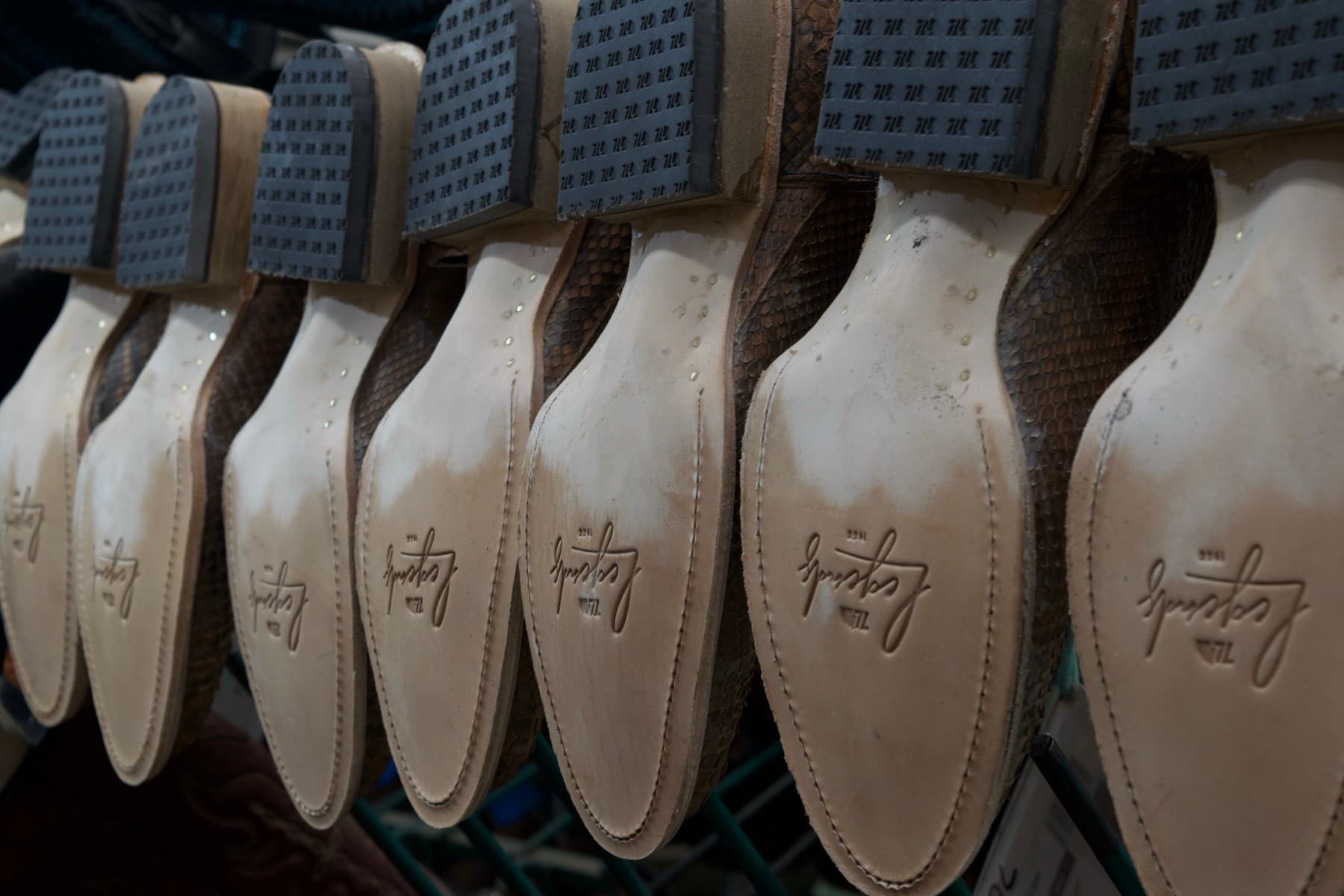 Freshly made shoe soles stamped with the brand's logo
